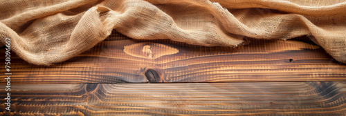 a wooden table with burlap fabric . Web banner with copy space . top view, 