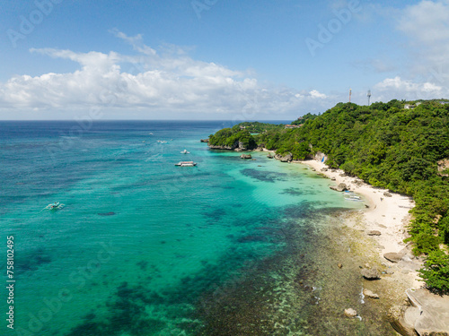 Fototapeta Naklejka Na Ścianę i Meble -  Tropical clear turquoise sea water with boats. Beaches in Boracay, Philippines.