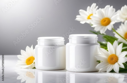 white bottles without inscriptions for shampoo on a white background with flowers in backlight with space for text 