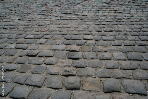  Cobblestone street texture. Antique rectangular paving stones. Path paved with stones and worn by its use. Road paved with cobblestones.