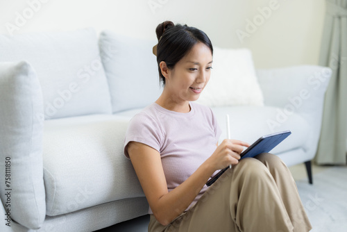 Woman watch on tablet computer at home
