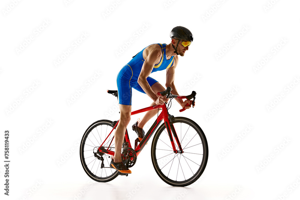 Athletic young man, cyclist in uniform, helmet and goggles in motion, riding bike isolated on white studio background. Concept of sport, active and healthy lifestyle, speed, endurance, hobby Athletic young man, cyclist in uniform, helmet and goggles in motion, riding bike isolated on white studio background. Concept of sport, active and healthy lifestyle, speed, endurance, hobby