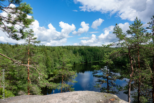 Summer lake scene at hiking trail in Nuuksio national park, Espoo, Finland.