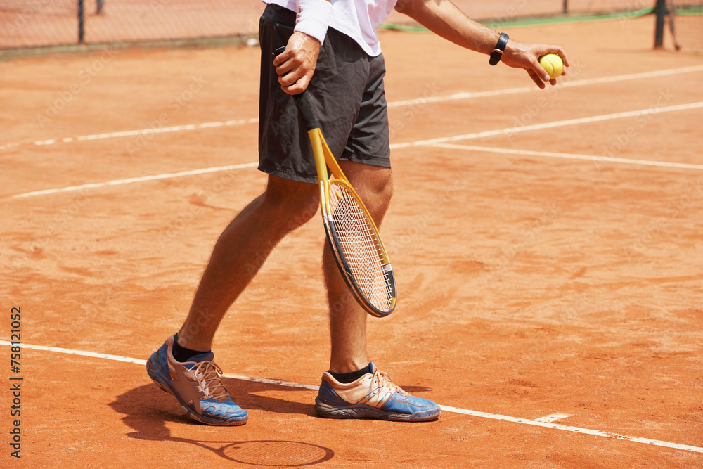 Man, playing and serve on tennis court, athlete and ball with racket for professional game. Exercise, outdoor sport and person in training for tournament, healthy and stance of champion player in set