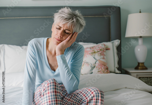 Quiet Moments of Concern: Middle-Aged Woman with Grey Hair Facing Insomnia