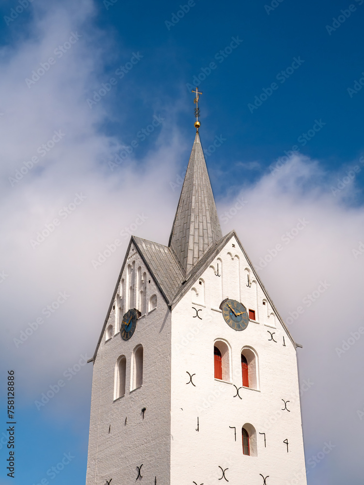 Fototapeta premium Tower of white Gothic brick church in Thisted, Nordjylland, Denmark