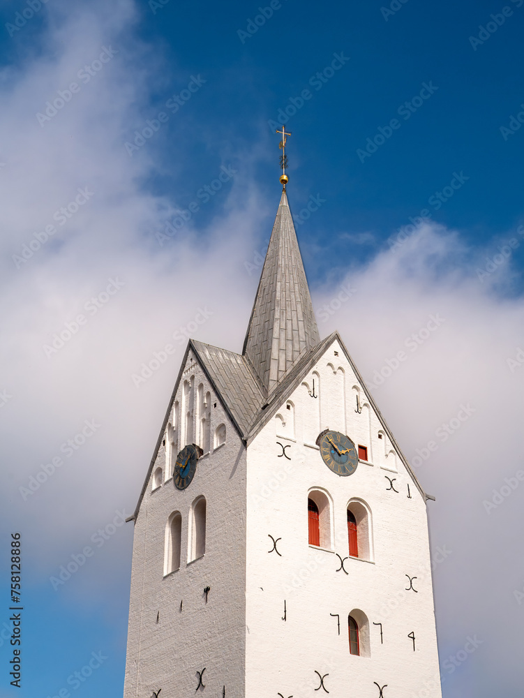 Tower of white Gothic brick church in Thisted, Nordjylland, Denmark