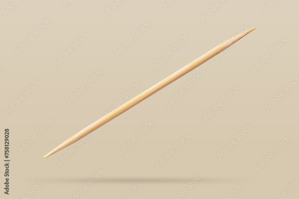 Wooden toothpicks isolated on brown background Wooden toothpicks isolated on brown background