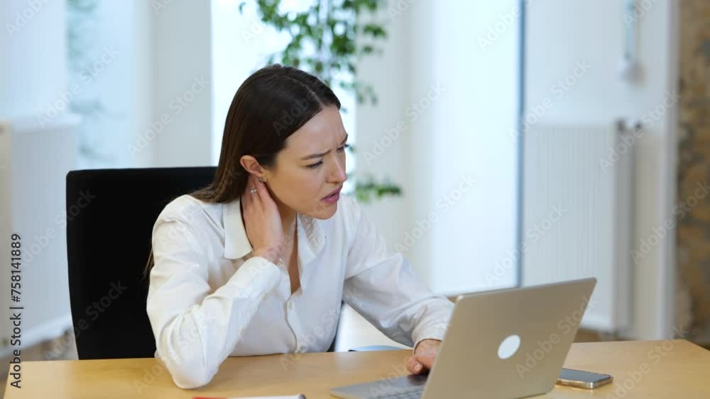 Business woman looking very tired after long working day in office on computer Business woman looking very tired after long working day in office on computer