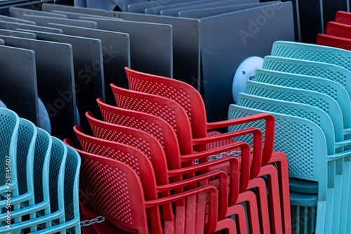 Stacks of plastic chairs and tables.