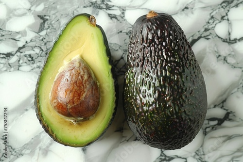 Two perfect avocados on a background of white marble, top view. daylight bright light. Space for text photo