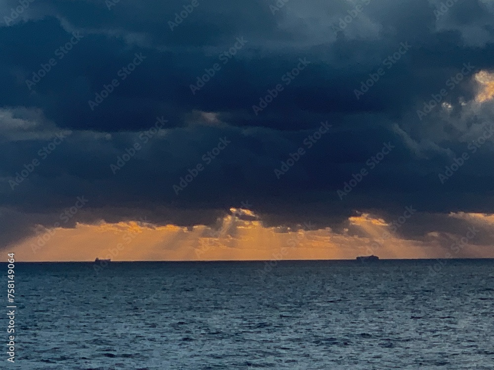 tanker at sunrise storm clouds