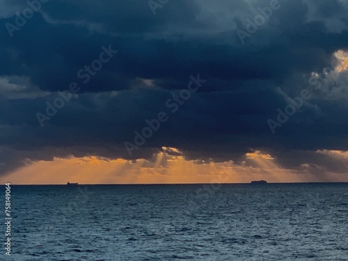 tanker at sunrise storm clouds