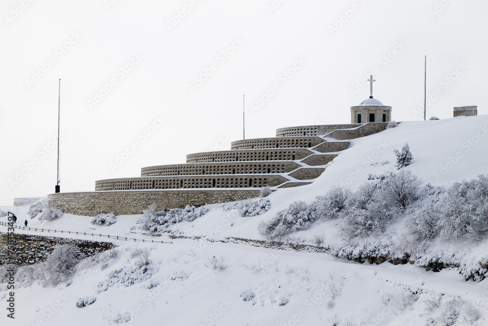 Fototapeta premium Mountain winter landscape. Mount Grappa war memorial building view