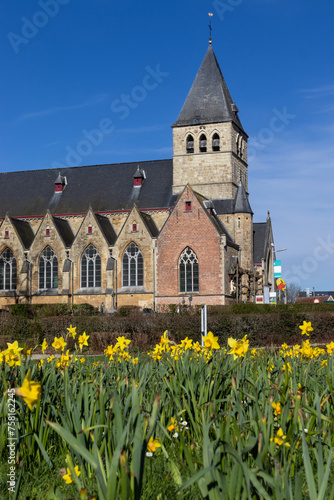 Springtime view of St.Martins (Sint Martinus) church in Herzele, East Flanders, Belgium. Copy space below.