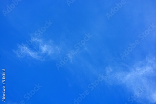 Beautiful and unusual nature, bright light blue sky with small white clouds. © Daria Katiukha