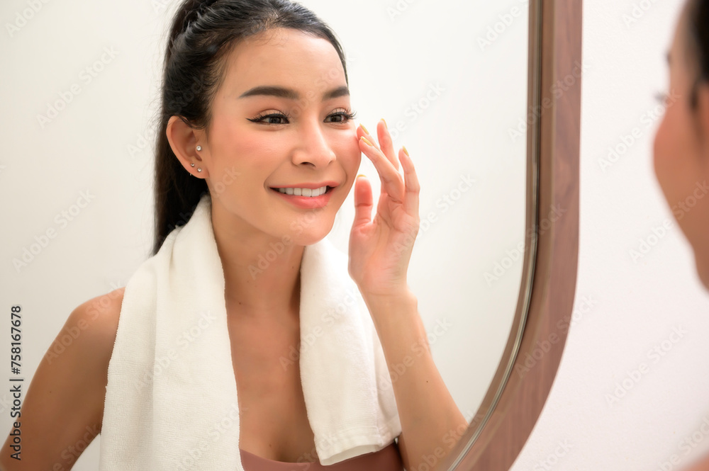 Beautiful asian woman is washing and cleaning her face Beautiful asian woman is washing and cleaning her face