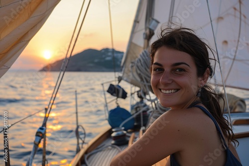 Woman with a beaming smile, embarking on a sunset sailboat cruise, the billowing sails and the salty sea breeze setting the stage for an evening of adventure and romance on the shimmering waters © Maelgoa
