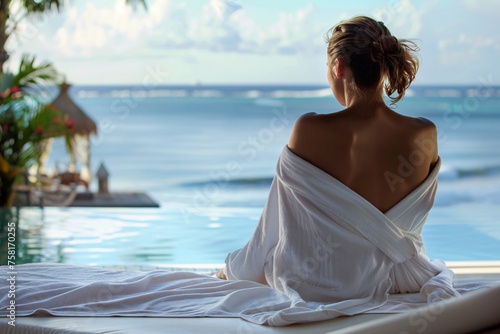 A stunning woman indulging in a luxurious spa treatment overlooking the Caribbean Sea  her birthday robe enveloping her in softness as she savors the tranquility of the tropical paradise