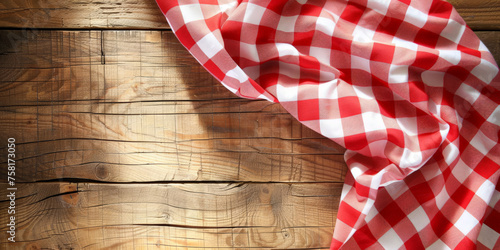  A red and white checkered tablecloth on a wooden background with copy space, banner