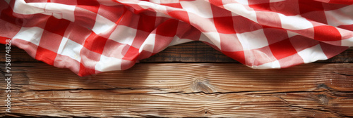  A red and white checkered tablecloth on a wooden background with copy space, banner