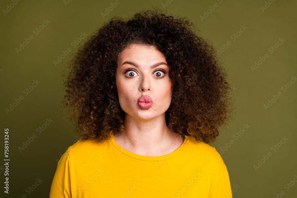 Closeup photo young funny chevelure hair girlfriend in yellow shirt pouted lips kiss you first date isolated on khaki color background Closeup photo young funny chevelure hair girlfriend in yellow shirt pouted lips kiss you first date isolated on khaki color background