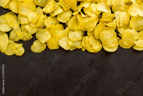 Set of homemade low calorie crispy potato chips in bowl, top view
