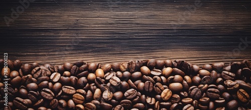 Aromatic Coffee Beans Scattered on Rustic Wooden Background for Gourmet Roasts and Barista Brews © Gular