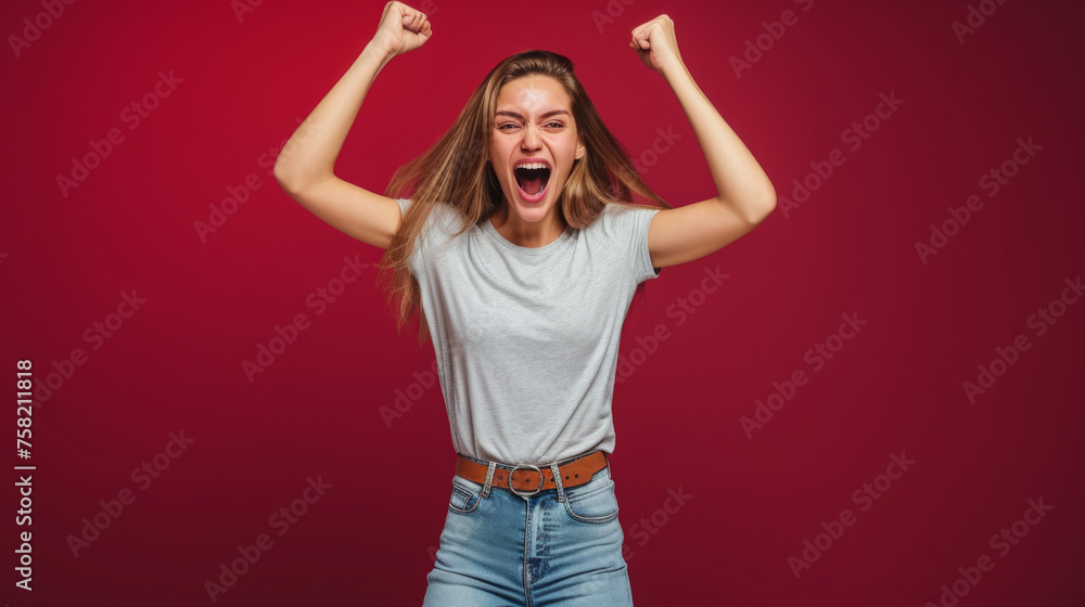 jubilant woman with her arms raised in a celebratory victory pose