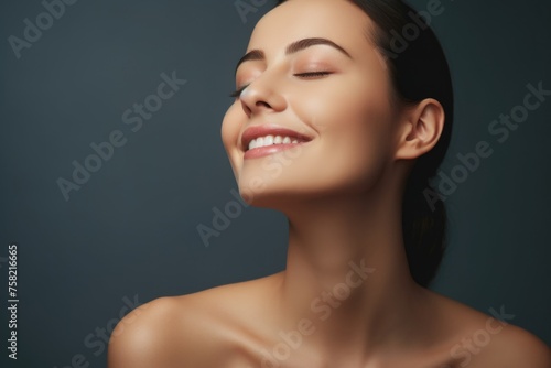 A woman with her eyes closed and a smile on her face. Suitable for various concepts and designs