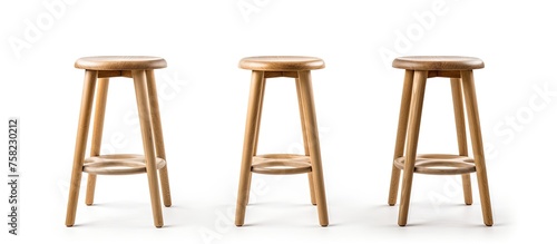Three bar stools made of wood are arranged in a line on a white background, creating a simple and stylish outdoor furniture setup