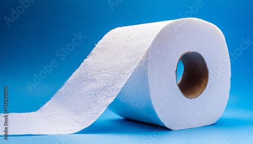 White toilet paper roll on isolated light blue background. Soft paper.