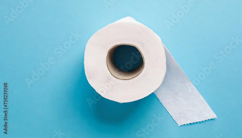 White toilet paper roll on isolated light blue background. Personal hygiene