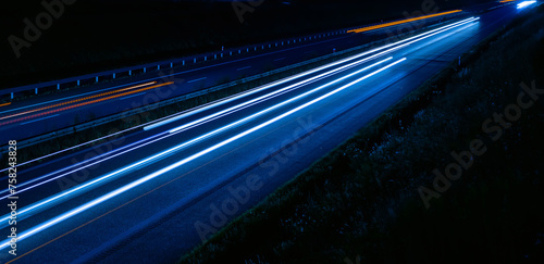 lights of cars driving at night. long exposure