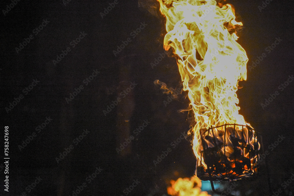 Flames of a coppara torch that lighting in Kandy Esala Perahera at Temple of the Tooth (Sri Dalada Maligawa), Kandy, Sri Lanka. - obrazy, fototapety, plakaty 