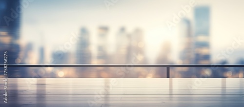 A rooftop balcony with a view of the city skyline, where the sky meets the horizon in a gradient of tints and shades, reflecting off the water below
