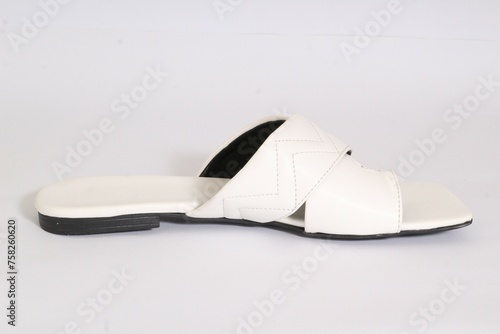 Picture of women flat chappal. Ladies' Flat Slippers are so easy to style and versatile that a basic wardrobe cannot do without them. easy to wear and take off.