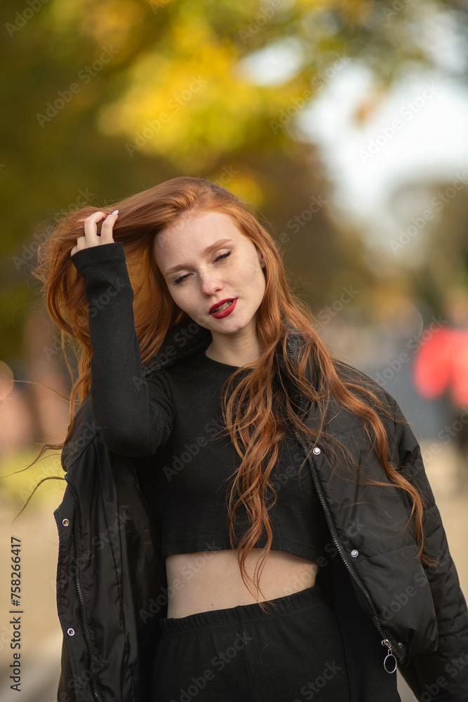 Portrait of a young beautiful red-haired girl outdoors. Portrait of a young beautiful red-haired girl outdoors.