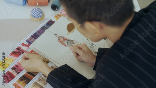 LGBTQ Designer working in fashion design studio © pigprox