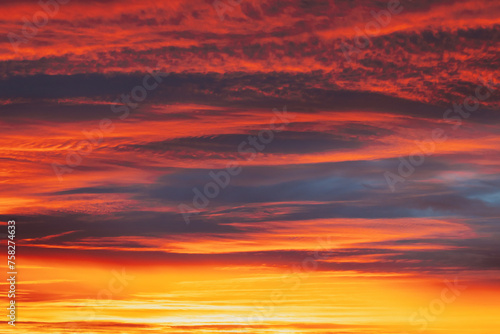 Abstract Saturated Orange-yellow Colors Of Clouds. Unusual Sky Background. Rich Orange Colors. Toned Pink-yellow Clouds. Sky Sunset Sunrise Background. Cloudy Sky. Sunny Cloudscape