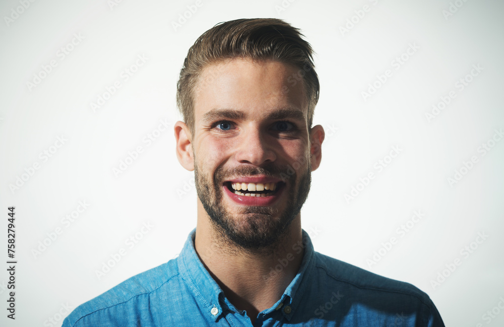 Sexy handsome unshaven man in denim shirt. Happy fashionable bearded man with charming smile. Joyful attractive man in casual clothes laughing. Positive emotions, feelings, facial expressions concept. Sexy handsome unshaven man in denim shirt. Happy fashionable bearded man with charming smile. Joyful attractive man in casual clothes laughing. Positive emotions, feelings, facial expressions concept.