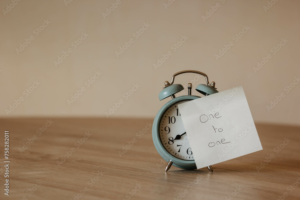 One to one meeting one to one alarm clock with post it one to one