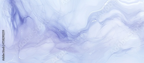 A closeup of swirling purple ink in water resembles a meteorological phenomenon. The electric blue pattern looks like a freezing landscape with waves and wind