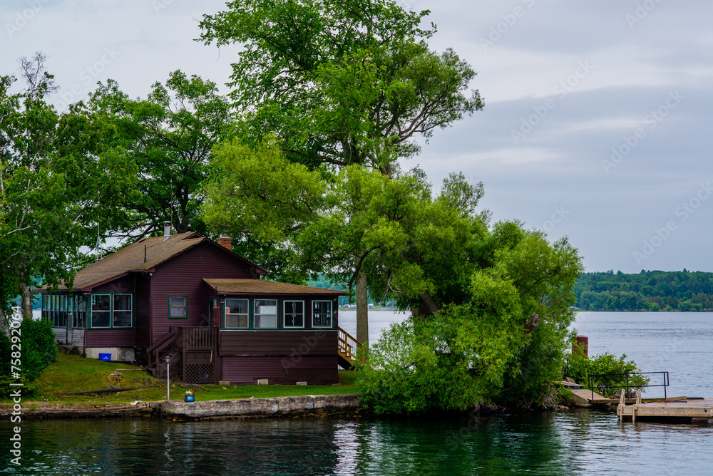 Ontario lake, Canada - June 24 2018: Cruise boat and resorts with deck in Ontario Lake