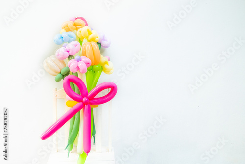 Balloons twisted into a blossoming flower bouquet on white background,Flowers Balloon to decorate the place,bouquet with colorful balloon flowers.