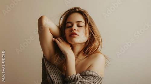woman with closed eyes with one hand up