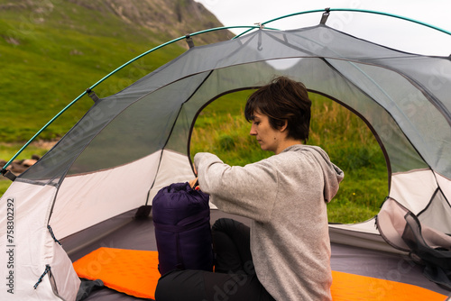 Grasslands Reverie: Tent Reading, as Sunlight Paints the Landscape with Golden Hues
