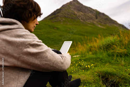 Valley Solitude: Scottish Grasslands Embrace a Reader Lost in Digital Worlds