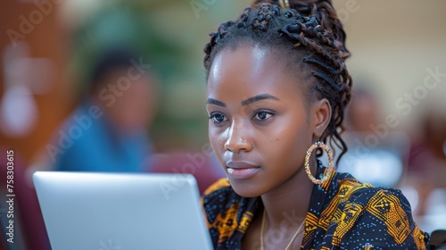 Woman Sitting in Front of Laptop Computer