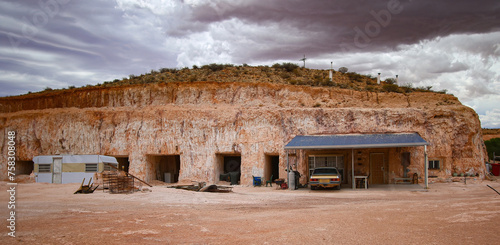 Hillside entrance to a dug out, an underground house in the opal mining town of Coober Pedy in the outback of South Australia photo